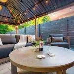 Uptown Oasis, Hot Tub, Swing Chairs, Fire Pit, Gazebo